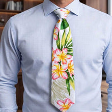 Load image into Gallery viewer, A man wearing a light blue dress shirt and a Plumeria Dream Hawaii necktie – Hawaiian floral tie made in Hawaii