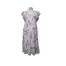 Load image into Gallery viewer, White dress with floral pattern on a mannequin against a white background