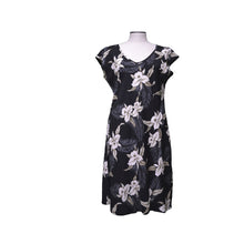 Load image into Gallery viewer, Black dress with white floral pattern on a mannequin against a white background