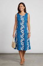 Load image into Gallery viewer, Woman wearing a blue Hibiscus Panel Hawaiian dress for women, an A-line knee-length women's Aloha dress handmade in Hawaii.