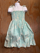 Load image into Gallery viewer, Green floral dress on a mannequin against a wooden background
