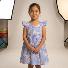 Load image into Gallery viewer, Little girl wearing the Plumeria Pattern cotton girls hawaiian dress with flutter sleeves, handmade in Honolulu.