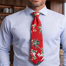 Load image into Gallery viewer, A man wearing a Aloha Christmas Hawaiian necktie black retro holiday print made in Hawaii
