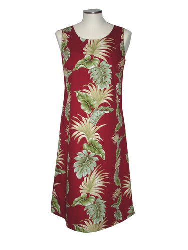 Red dress with tropical leaf pattern on a mannequin against a white background