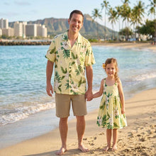 Load image into Gallery viewer, Father and daughter wearing matching Hibiscus Floral tropical Hawaiian matching sets, featuring a men's Aloha shirt and a girls' dress handmade from 100% cotton poplin in Honolulu.
