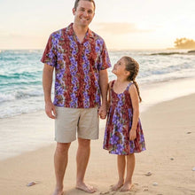 Load image into Gallery viewer, Father and daughter wearing matching Lei of Aloha Hawaiian print family outfits, featuring a men's Aloha shirt and a girls' Hawaiian dress made of 100% cotton poplin.
