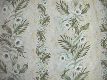 Load image into Gallery viewer, A close-up of a vintage floral patterned fabric or wallpaper featuring white and olive green tropical flowers and leaves on a warm beige background with subtle gold foil-like accents.
