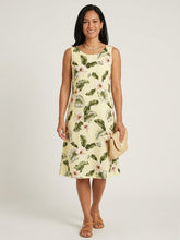 Load image into Gallery viewer, Woman wearing a coral Pearl Hibiscus flowy rayon Hawaiian dress for women, an A-line knee-length women's Aloha dress handmade in Hawaii.
