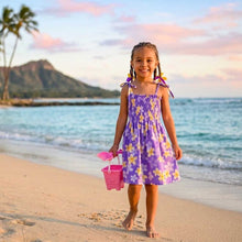 Load image into Gallery viewer, Little girl wearing a Plumeria Pattern cotton girls hawaiian dress, an authentic kids aloha wear outfit handmade in Honolulu.
