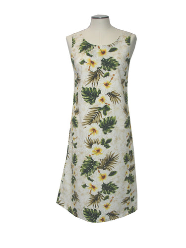 Sleeveless dress with tropical leaf and flower pattern on a mannequin against a white background