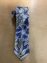 Load image into Gallery viewer, A Hawaiian necktie with a reverse print featuring a large hibiscus flower in purple, yellow, and green on a dark background.
