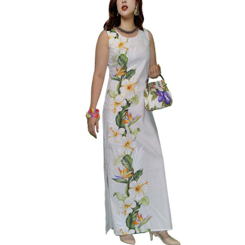Woman in handmade white maxi Hawaiian dress with hibiscus and bird of paradise flowers – sleeveless 100% cotton tropical sundress